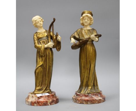 A pair of Alphonse Gori ivory and ormolu figures of medieval musicians, girl playing an Irish harp, the other plucking a viol