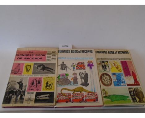 A collection of nine 'Guinness book of Records' books - 1966,1968,1969,1970,1971,1927,1973,1974,1975.First three with dust Ja