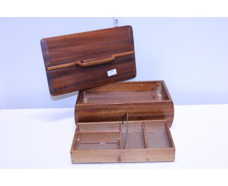 A vintage wooden sewing box with lid 