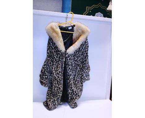 A vintage leopard print coat with fur coat 