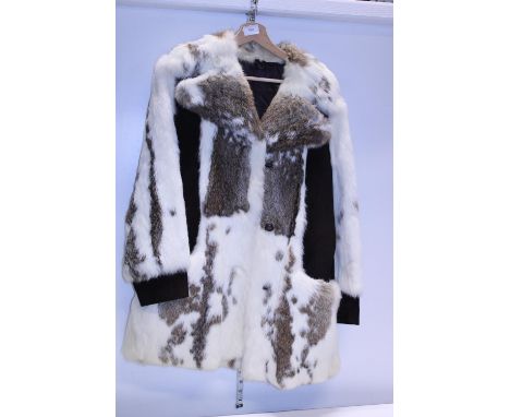 A vintage real fur coat with suede accents 