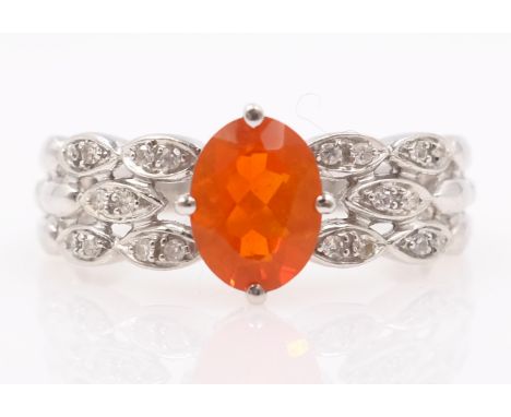 White gold fire opal and diamond ring hallmarked 9ct   Condition Report  Approx 3.1gm size S-T Click here for further images,