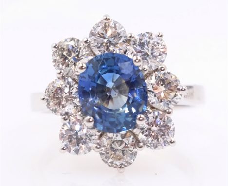 White gold oval sapphire and round brilliant cut diamond cluster ring hallmarked 18ct sapphire approx 2 carat diamonds approx