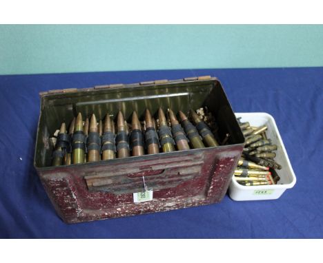 A link of twenty two .50 cal inert rounds, some WWII dated, with a box of mixed rifle blanks including .303 examples