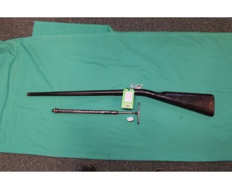 A Victorian air rifle/cane of approx 120 bore with leather covered air reservoir stock, this lot also comes with its key and 