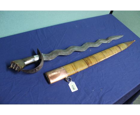 A very unusual sword with possible connections to the Philippines Katipunan, the hilt being a clenched fist with white metal 