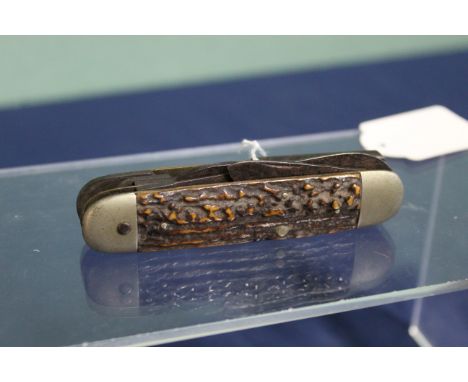 A vintage multi-tooled pocket knife, one blade shortened