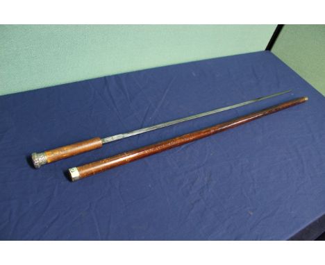 A Victorian swordstick with white metal pommel and collar and a 28" blade with a 18" central fuller, a good honest swordstick