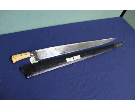 A Victorian Afghan 'Khyber knife' of larger than average length (27") complete with leather scabbard, which has brass ornate 