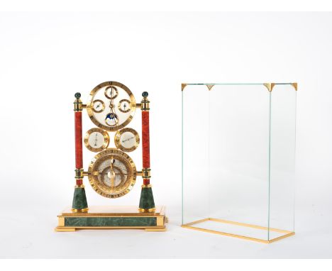 It is made up of four quadrants: one with indication of hour, minute, day, month and moon phase. At the base a small astrolab