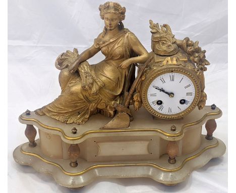A late 19th/early 20th century French mantel clock, reclining figure raised on alabaster base, 8 day movement