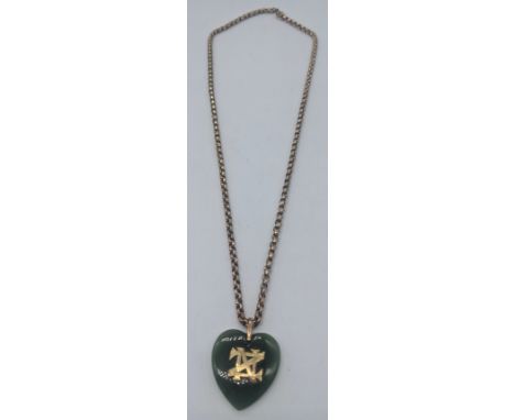 A jade heart shaped pendant with gold chain and monogram, indistinct marks to clasp, chain weight 12.9g