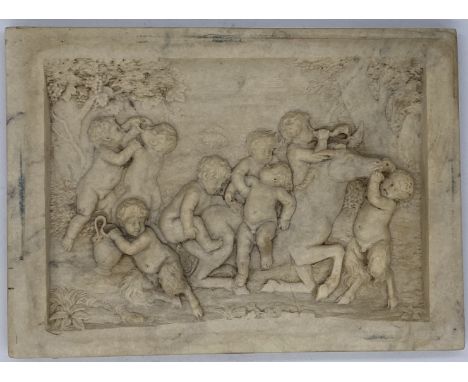 A classical scene of cherubs and fauns playing with a donkey in a forest scene, stone plate, verso inset with intaglio of Ero