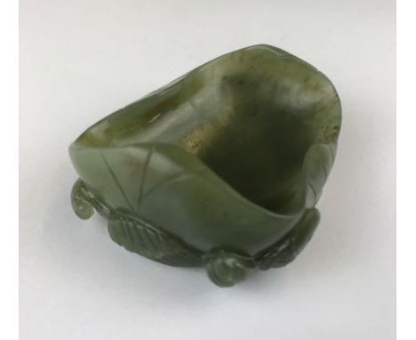 A Chinese carved nephrite jade brush washing bowl, W. 8cm.