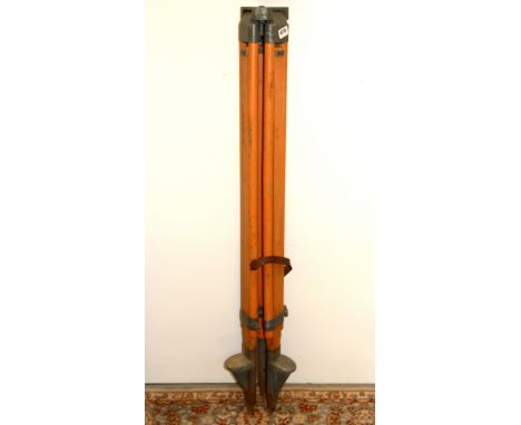A vintage surveyor's tripod, L. 113cm.