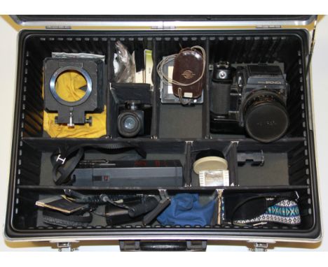 A photographic carrying case with a Bronica SQ camera etc.