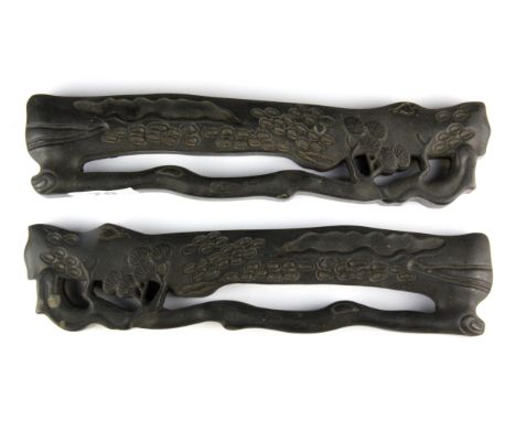 A pair of Chinese carved hardwood scroll weights, L. 27cm.
