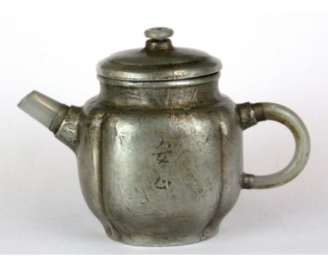 A Chinese pewter covered Yixing terracotta teapot with white jade spout and handle, H. 11cm spout to handle W. 15cm.