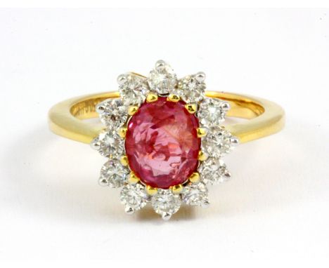 An 18ct yellow gold cluster ring set with a 2.19ct oval cut Burmese untreated ruby and brilliant cut diamonds, with an IGI ru
