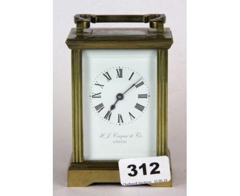 A gilt brass carriage clock by H.S Cooper and co London, H. 14cm.