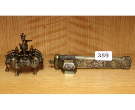 Islamic interest. A silver and copper decorated brass inkwell and Persian spice box, inkwell L. 18cm.
