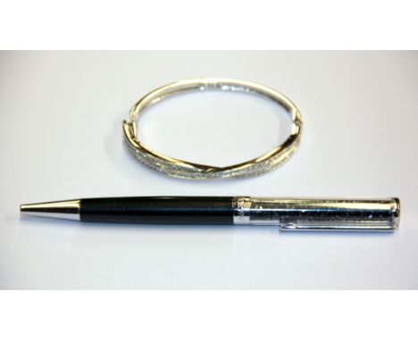 A Swarovski bangle and Swarovski crystal pen.