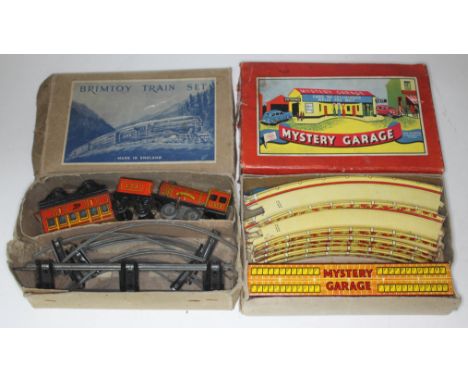 Two boxed vintage toys Brimtoy Trai Set and Mystery Garage.  