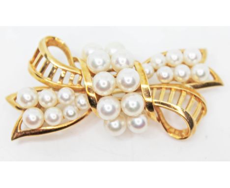 A Mikimoto 14ct gold and cultured pearl brooch, marked 'K Mikimoto Tokyo K14', length 51mm, gross wt. 14.3g.  Condition - goo