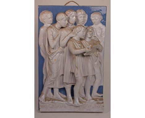 After Luca Della Robbia (1400-1482), a 19th century tin glazed terracotta plaque depicting a group of choir boys copied from 