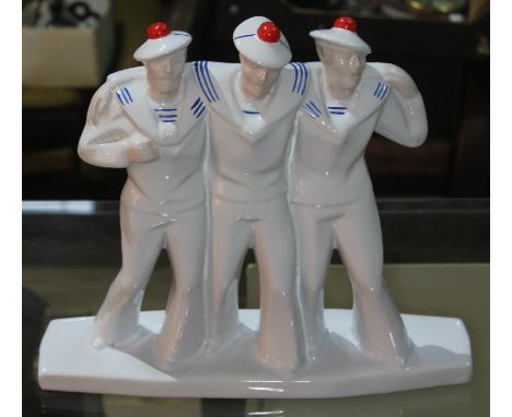 A reproduction Art Deco three drunken sailors figure, height 28cm, width 32cm.  Condition: no marks to base, large crack acro