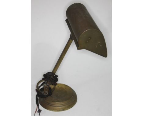 An early 20th century adjustable brass desk lamp.  