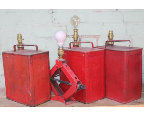A group of four lamps, three formed from vintage petrol cans and the other a car jack.  
