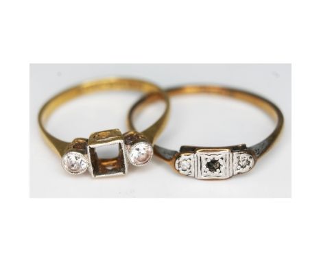 Two gold rings set with colourless stones, one marked '9ct &amp; PLAT', together with another marked 'PT18ct', gross wt. 3.8g