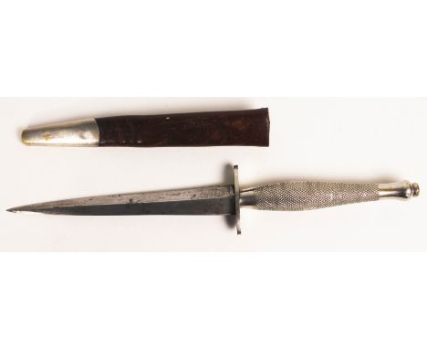 A WWII FS commando fighting knife with scabbard, length 31cm.  