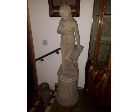 A concrete garden statue depicting a semi nude lady on fluted plinth, height 155cm. 