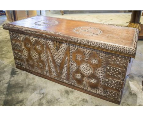 ZANZIBAR TRUNK, 19th century Moorish hardwood and brass studded with rising lid and carrying handles, 102cm x 45cm x 43cm H.