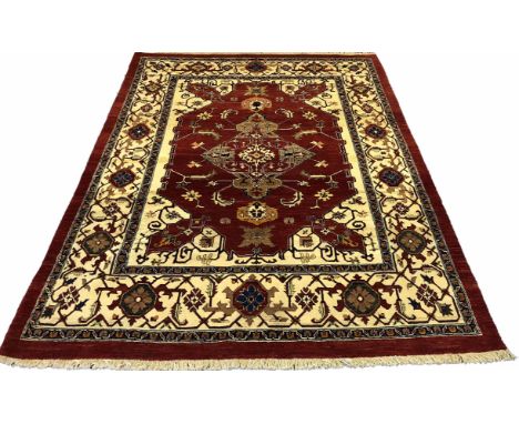 FINE PERSIAN HERIZ CARPET, 270cm x 208cm, central medallion on a ruby field of palmettes and vines within ivory spandrals and