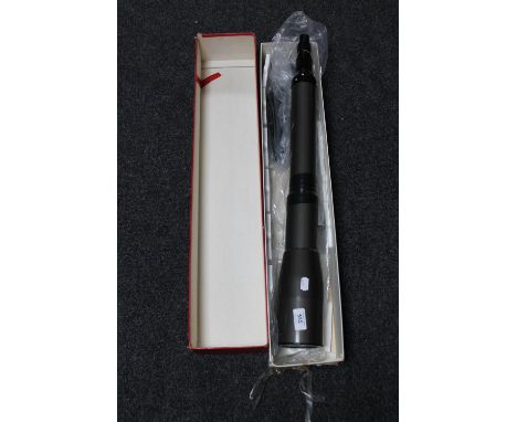 A telescope with tripod in box 