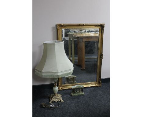 A gilt framed mirror, small onyx clock and an onyx and brass table lamp 