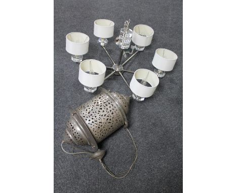 A contemporary ceiling light and a metal hanging lantern 