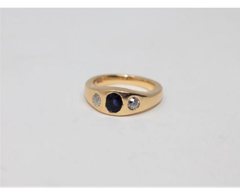 An 18ct gold diamond and sapphire three stone ring, size N CONDITION REPORT: 10.7g
