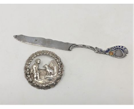 A Norwegian silver and enamel letter knife by David Andersen, circa 1900, together with a white metal brooch depicting a boy 