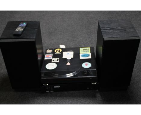 A Quartz Limit turntable, KAM power amplifier and a pair of Mission speakers with remote 