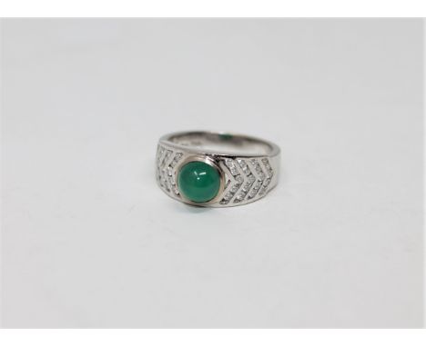 An 18ct white gold cabochon emerald and diamond ring, 6.55g