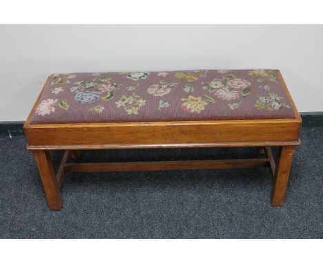 An oak framed tapestry seated duet stool 