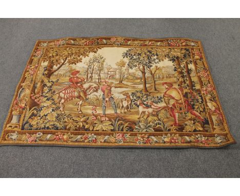 A large tapestry wall hanging depicting figures hunting 