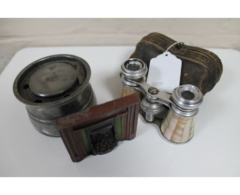 A small travelling inkwell, opera glasses in case, miniature fire place 