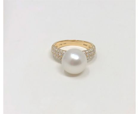 A 14ct yellow gold pearl and diamond ring featuring a cultured Akoya pearl with fifty six round brilliant cut diamonds, size 