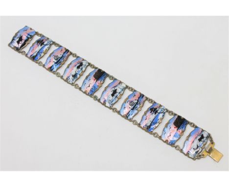 A Norwegian silver gilt and enamel panel bracelet, depicting winter and coastal landscapes, length 19cm. 