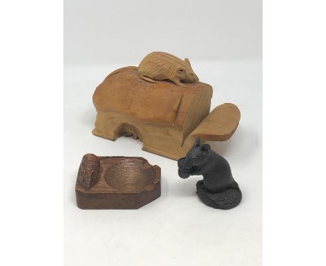 A 'Mouseman' oak ashtray, a resin figure of a mouse holding a thimble and a carving of a mouse on a sliced loaf of bread